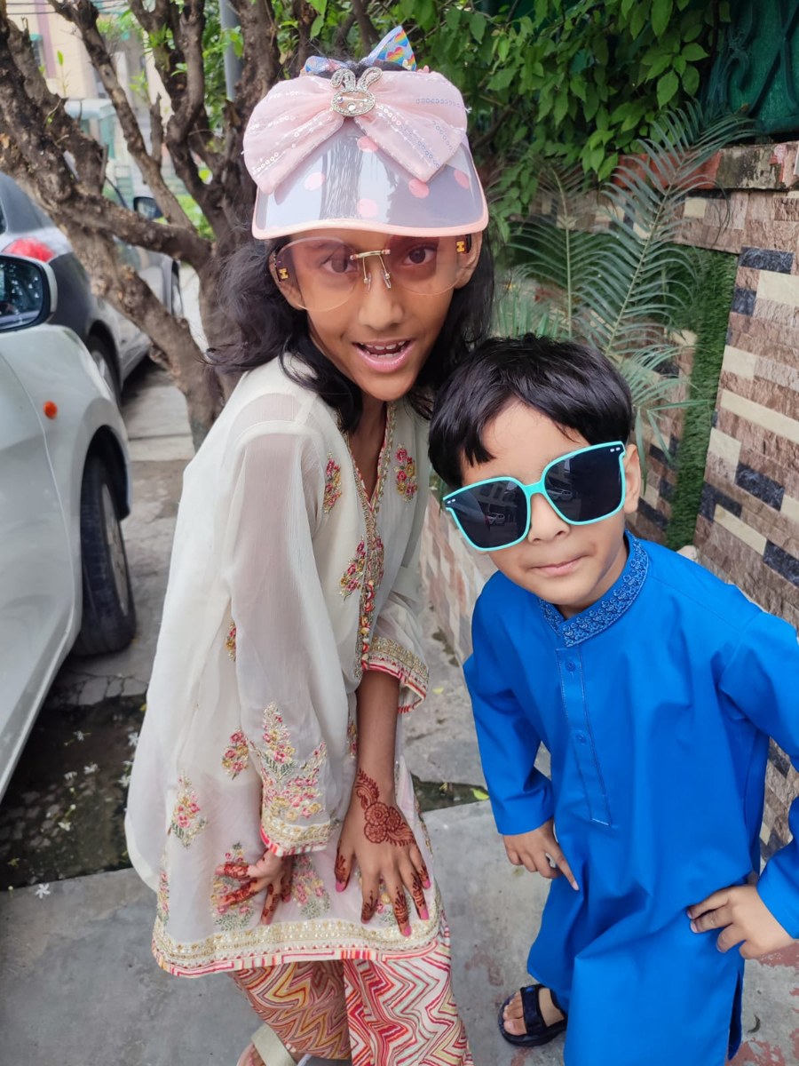 Hareem Fatima, designer and developer of PetPal, posing with a friend